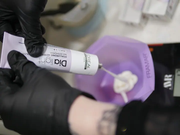 Professional colour product being measured for a custom formula