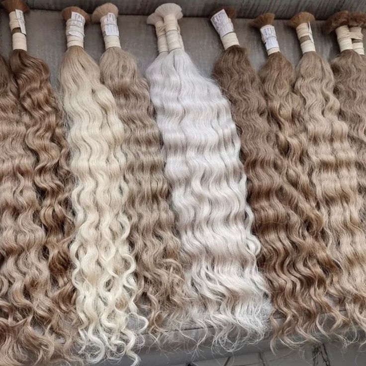 Wavy premium extension hair bundles in soft blonde and brunette shades